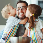 dad with his two kids baking