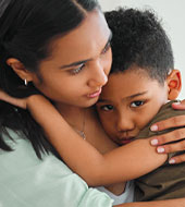 woman hugging a child