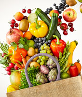 produce spilling out of a canvas bag