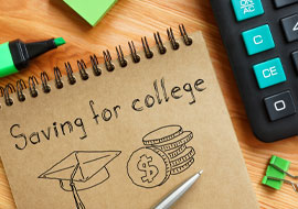notebook with Saving for College written on it and a illustraiton of a graduation cap and coins
