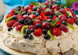 Photo of pavlova with berries on top