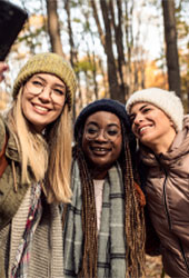 3 women taking a selfie in the fall outdoors