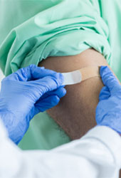 person getting a flu shot in their arm