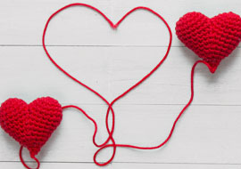 3 hearts made of red yarn