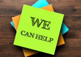 green sticky note with we can help written on it